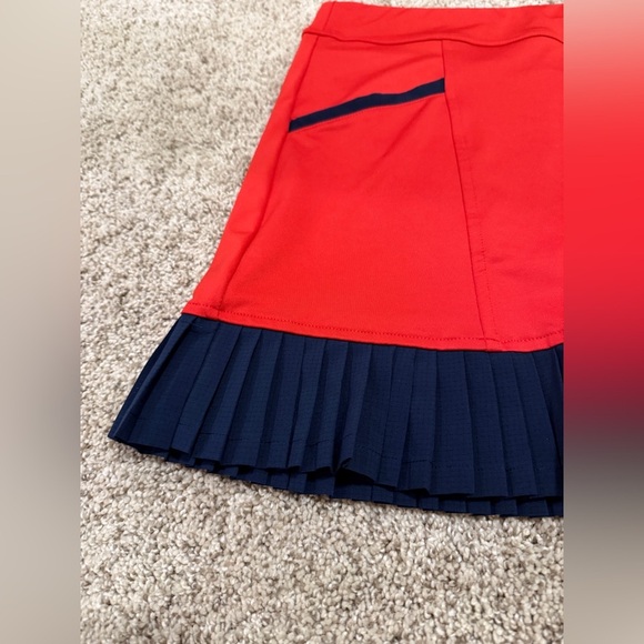 InPhorm NYC Kai Pleated tennis skort in poppy red and navy - Picture 7 of 11
